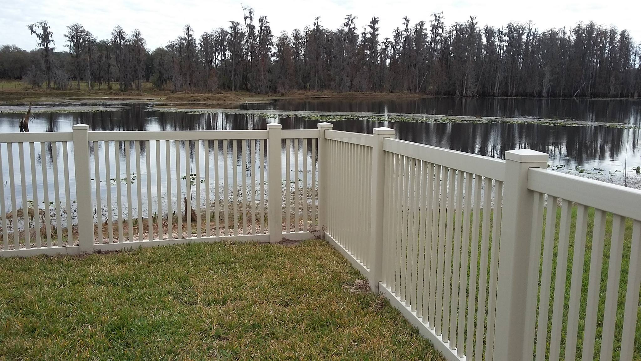 White fence along a waterfront property